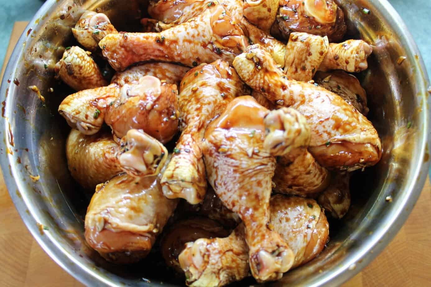 3 lbs chicken drumsticks marinating in a bowl