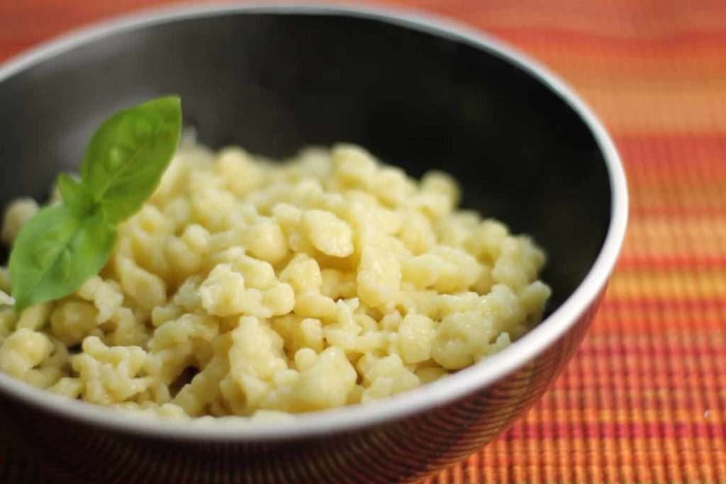 A close up of traditional German spätzle in a black bowl