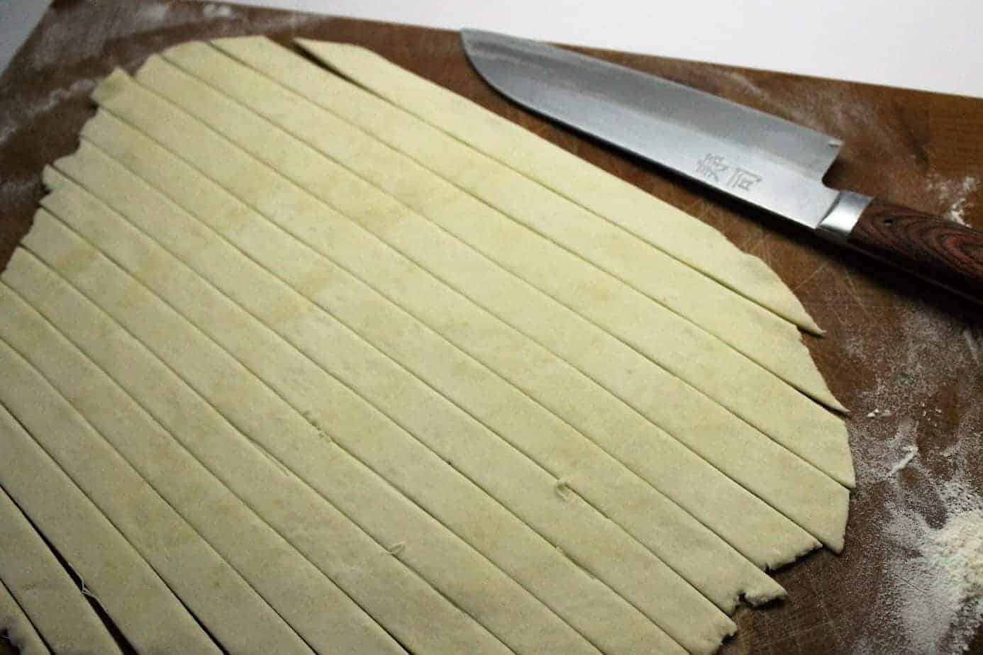 pie dough cut into strips to form a lattice top