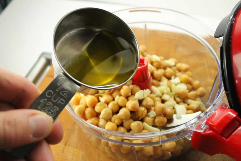 adding oil to the chickpeas