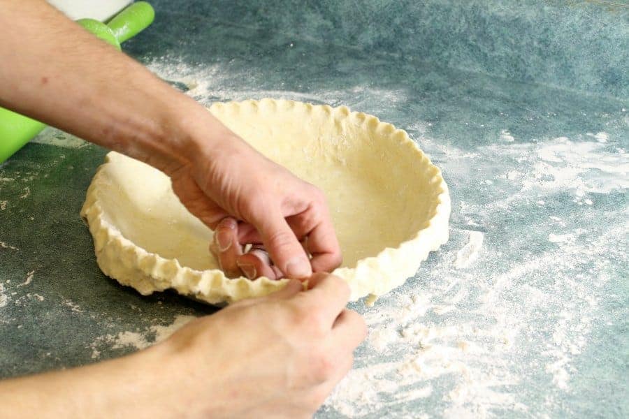 crimping the edges of a homemade pie crust