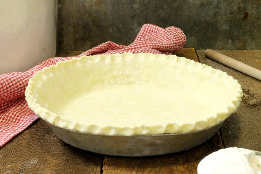 a homemade pie dough in a pie pan ready to use
