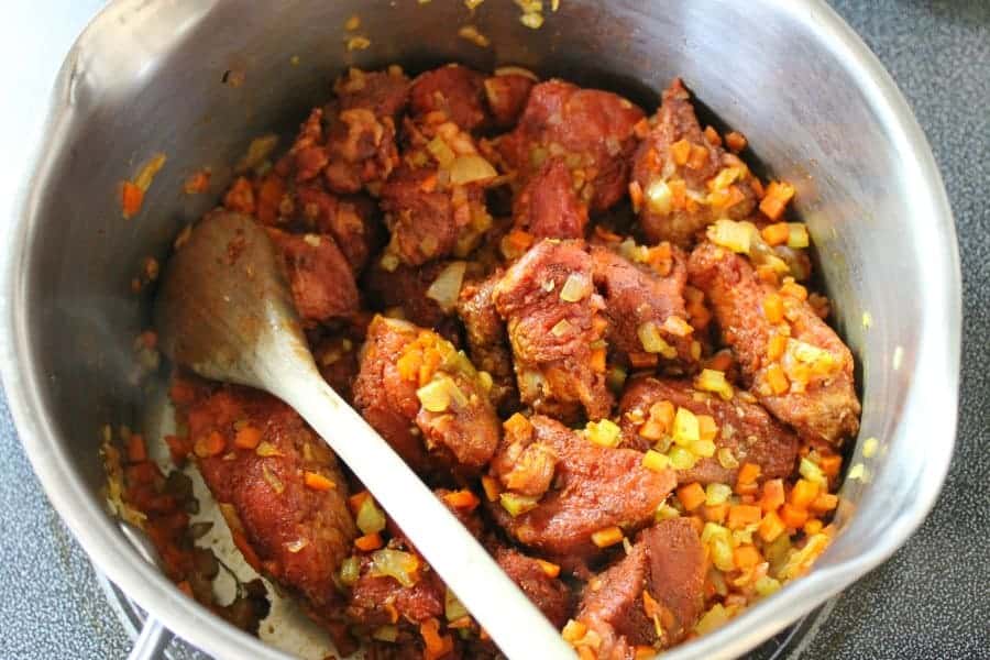 Diced marinated beef chuck and mixed vegetables being sauteed to make homemade German goulash.