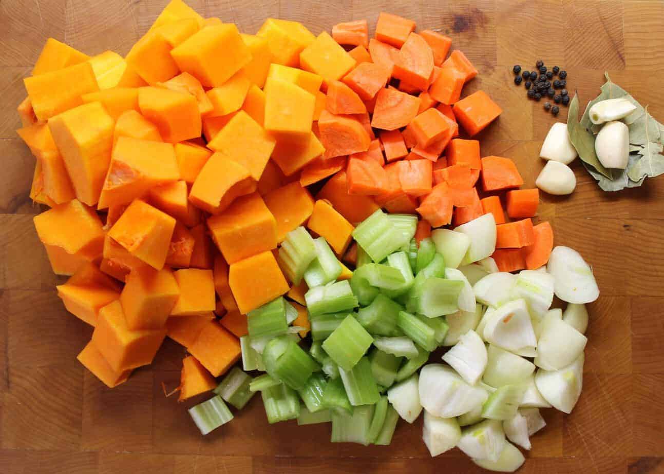 Butternut Squash Soup prep- Diced squash, carrot, onion, garlic, peppercorns and bayleaf