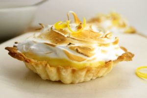 lemon meringue tart on a white plate