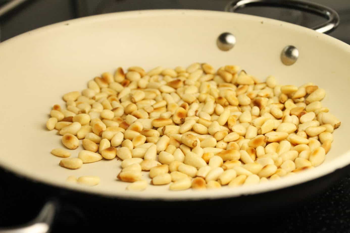 Roasting pine nuts in a pan