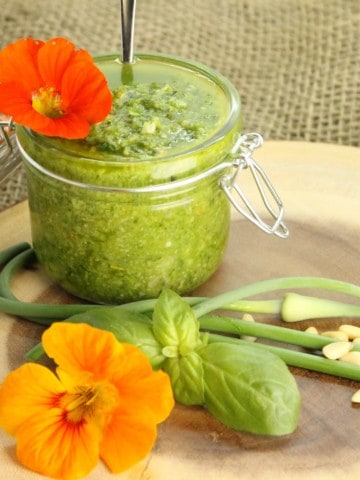 A deliciously simple Basil Pesto recipe using Garlic Scapes from the garden. A great way to preserve your basil harvest.