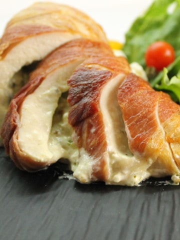 Savory stuffed chicken breasts wrapped in Prosciutto are a delicious and surprisingly easy meal to make.