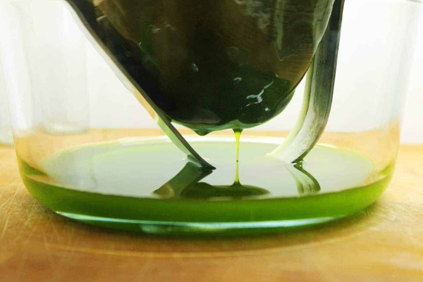 straining green Chive Oil