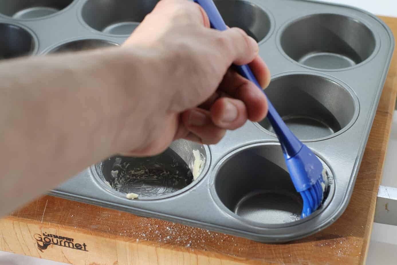 properly greased muffin pans will help these buttermilk cranberry muffins rise properly