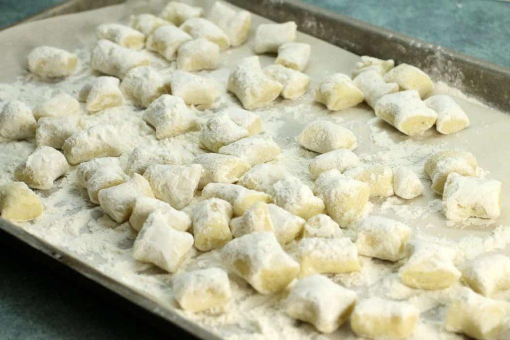 Freeze fresh gnocchi dumplings on a well floured tray to prevent them from sticking