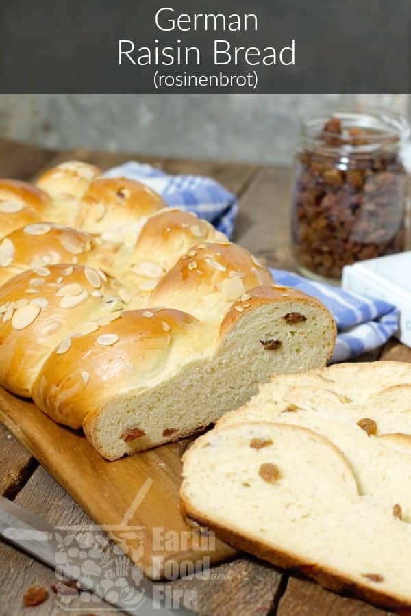 vertical pinterest image of german raisin bread (rosinenbrot) sliced and displayed on a wood cutting board