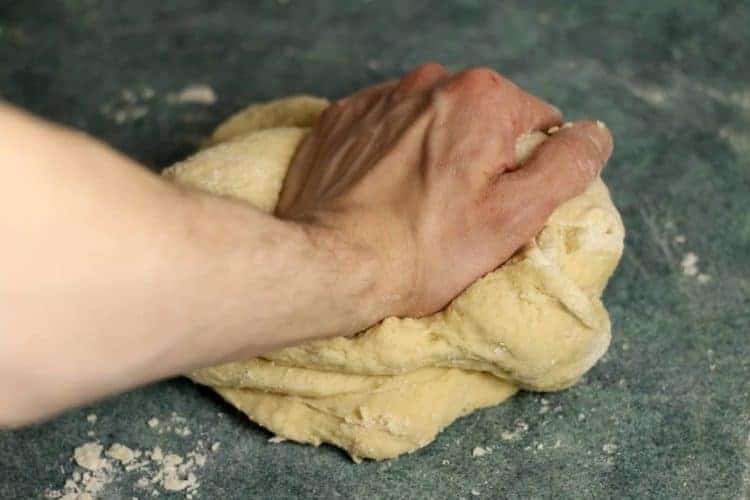 Knead the mixed Raisin Bread dough until it's soft and smooth.
