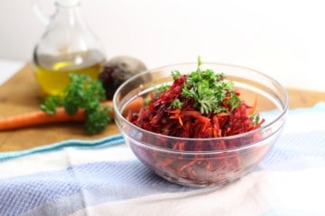 Using just a simple box grater, this healthy shredded beet salad with, carrots, apples, and walnuts is a great side to any meal. Clean eating and Paleo friendly