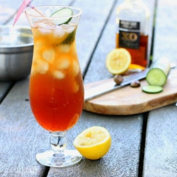 a glass of real bajan rum punch on a picnic table