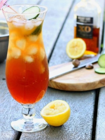 a glass of real bajan rum punch on a picnic table