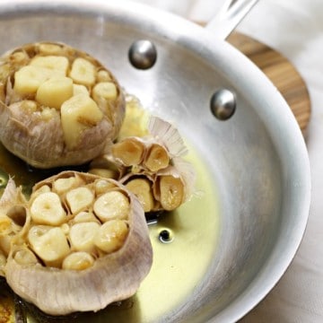 oven roasted garlic in a steel frying pan