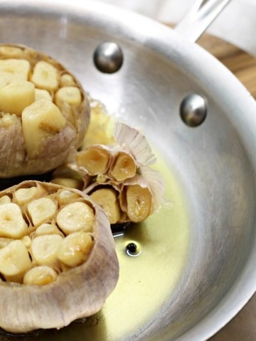 oven roasted garlic in a steel frying pan