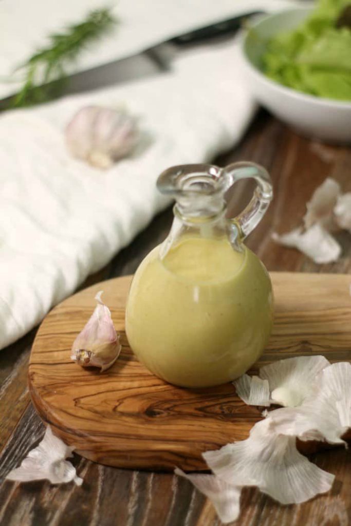 This easy to make creamy roasted garlic salad dressing will instantly become your go to dressing!