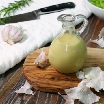 This easy to make creamy roasted garlic salad dressing will instantly become your new favorite vinaigrette. Ideal for use with a wide variety of salads.