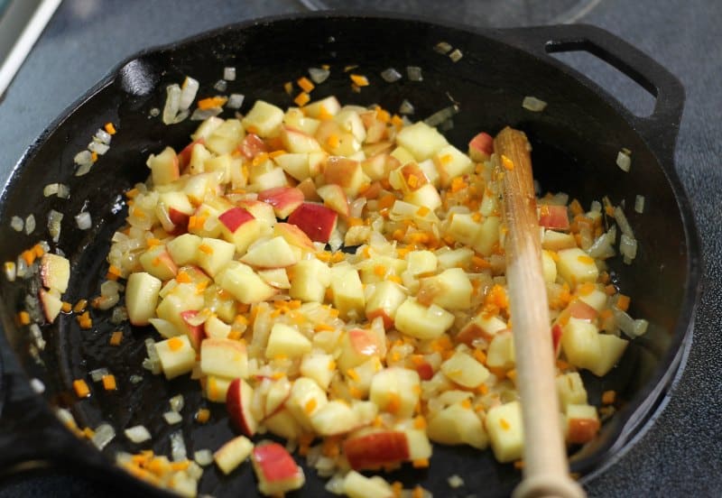 Add the apples to the stuffing mixture and half cook them.