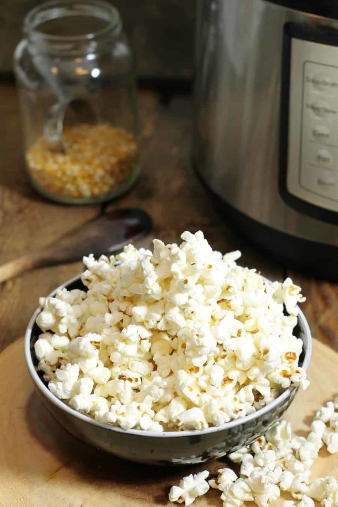 Freshly popped Instant pot popcorn in a black bowl