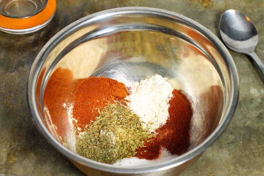 Various spices in a steel bowl to make homemade blackened seasoning