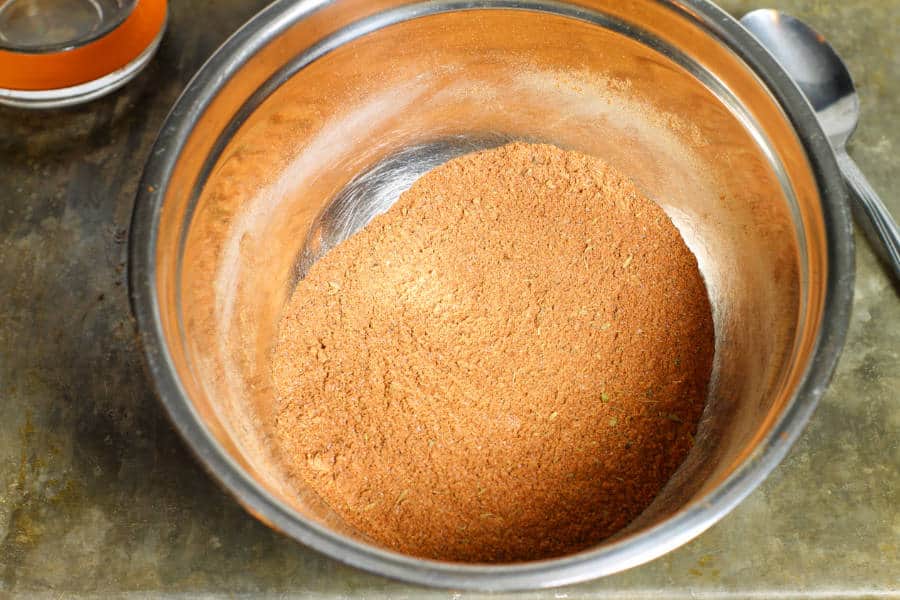 Freshly mixed blackening spice in a steel bowl.