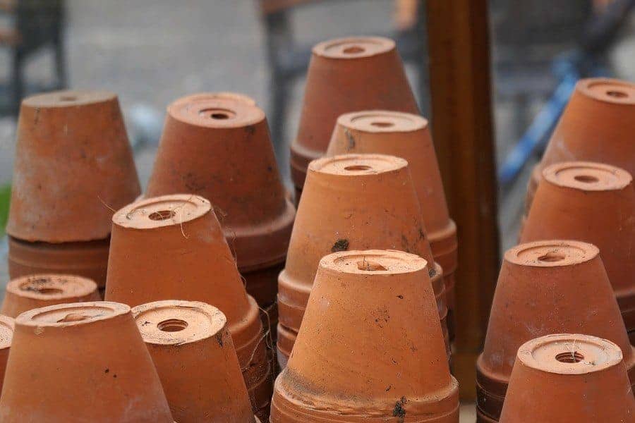 clay flower pots stacked in rows