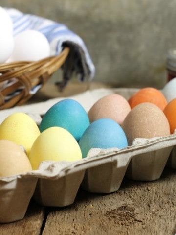 A dozen naturally dyed easter eggs made with homemade easter egg dye