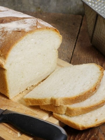 a fresh loaf of freshly baked white sandwich bread