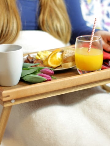 A breakfast in bed tray for mothers day on a bed