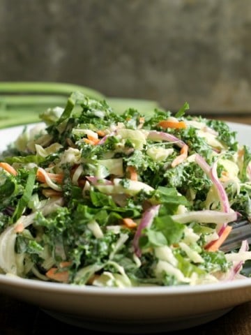 A simple kale slaw ready o be served at a family bbq or potluck