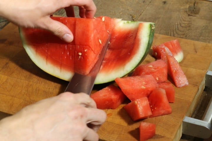 cutting a watermelon into cubes