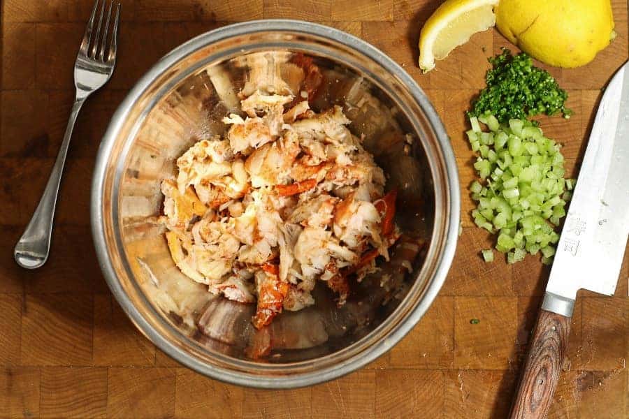 freshly chopped lobster meat in a bowl to be mixed for lobster rolls