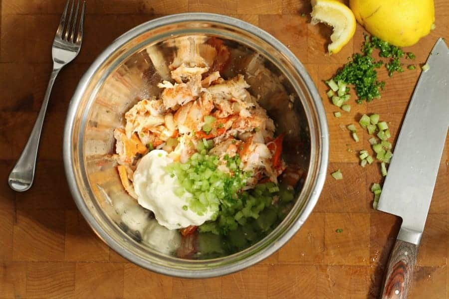 lobster roll ingredients in a metal bowl prior to mixing