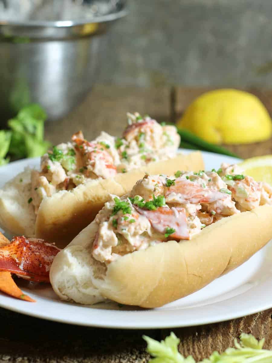 traditional PEI lobster rolls served with fresh lemon in a bun