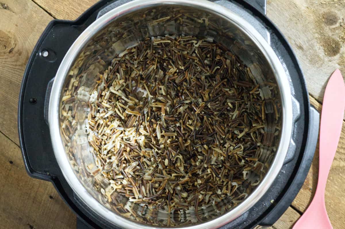 top down view of cooked wild rice inside an Instant Pot