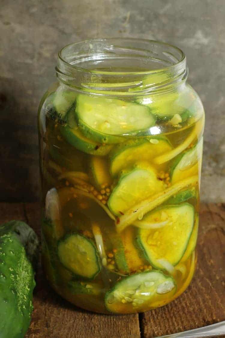 A jar of refrigerator bread and butter pickles ready to eat.