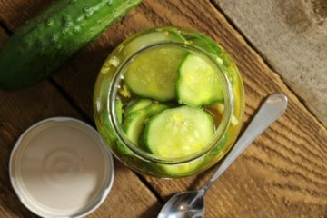 a top down view of a jar of refrigerator bread and butter pickles