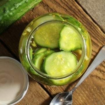 a top down view of a jar of refrigerator bread and butter pickles