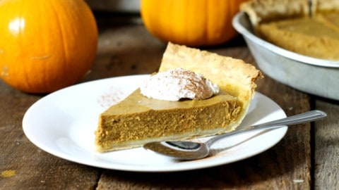 close up shot of a slice of dairy free pumpkin pie