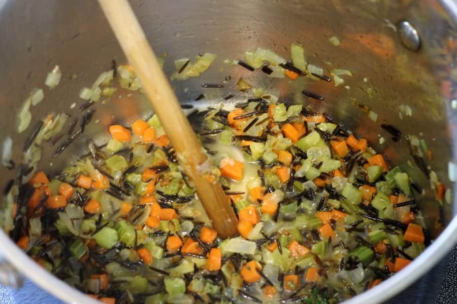 deglazing the pot of soup with white wine