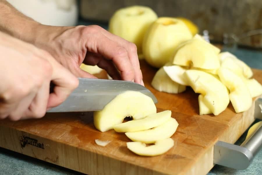 honeycrisp apples being sliced to make apple sauce
