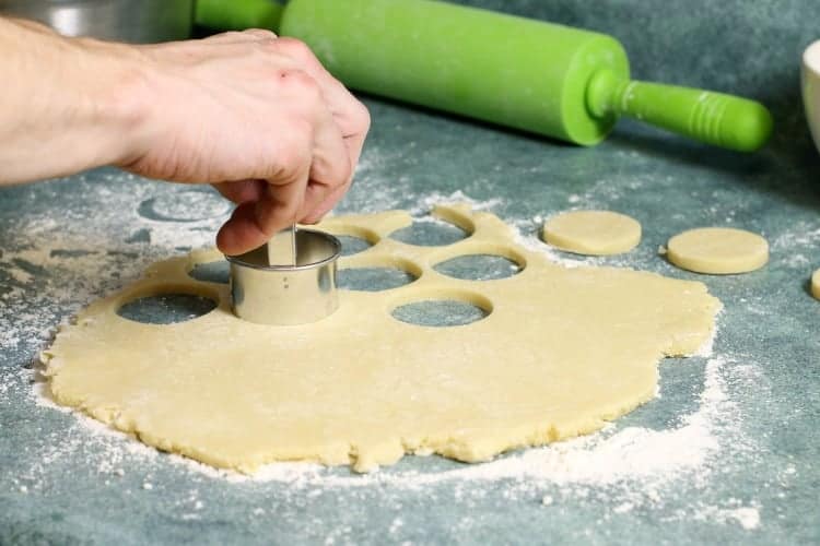 cutting out shortbread rounds with a cookie cutter