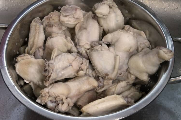 blanched chicken wings in a colaner