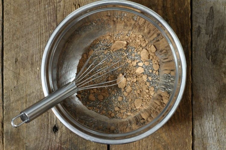 mixing dry chia seed, cocoa powder and salt in a bowl