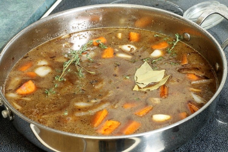 deglazing a frying pan with wine and stock