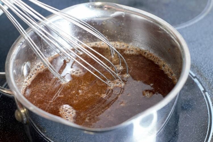 honey and pineapple glaze simmering on the stove