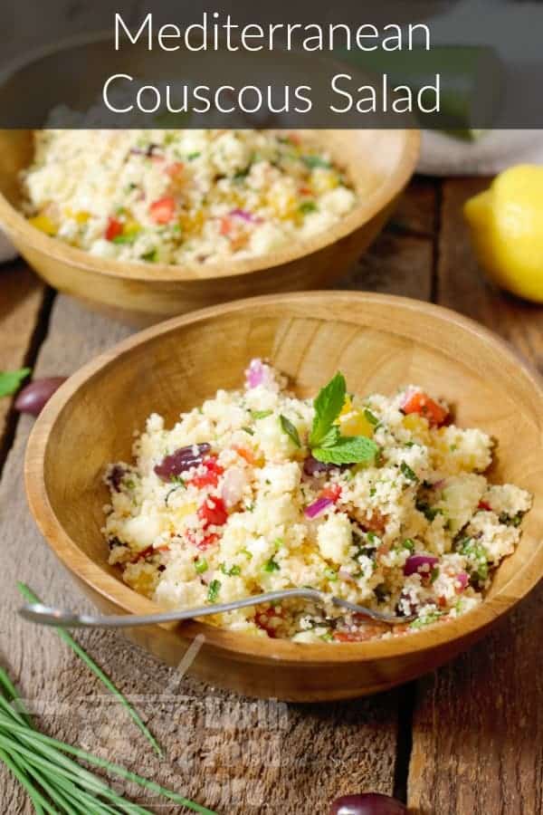 A pinterest image of Mediterranean Couscous Salad in wooden bowls overlaid with a text banner.